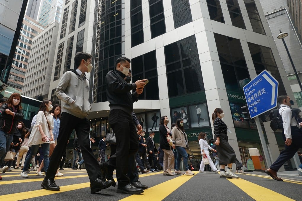 People cross the road in Hong Kong’s Central district on March 30. If we want our workplace to reflect the diversity in society, our hiring practices must keep up. Photo: Felix Wong