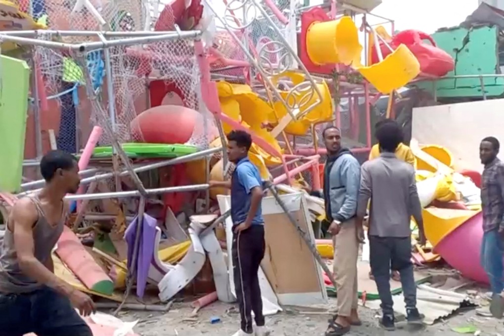 People inspect a damaged playground following an air strike in Mekele, Ethiopia’s Tigray. Photo: Tigrai TV/Reuters