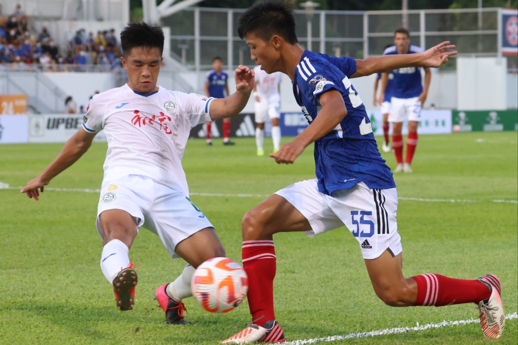 Eastern winger Ma Hei-wai (blue), is tackled by Law Chun-ting of Tai Po. Photo: Dickson Lee