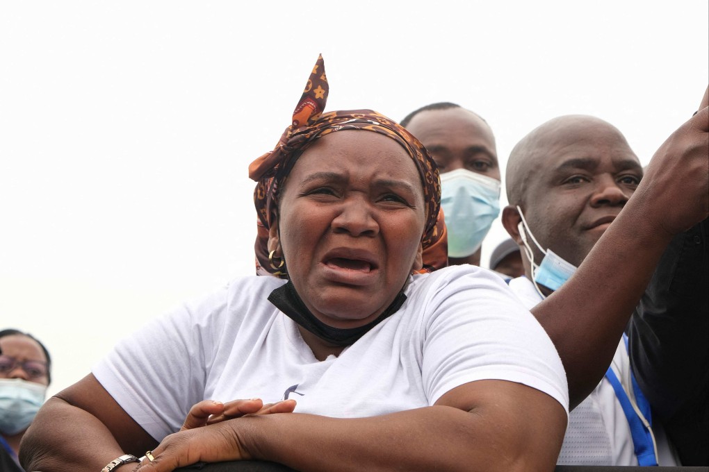 A mourner reacts during the state funeral of former Angola President Jose Eduardo dos Santos at the Praca da Republica in Luanda on Sunday. Photo: AFP