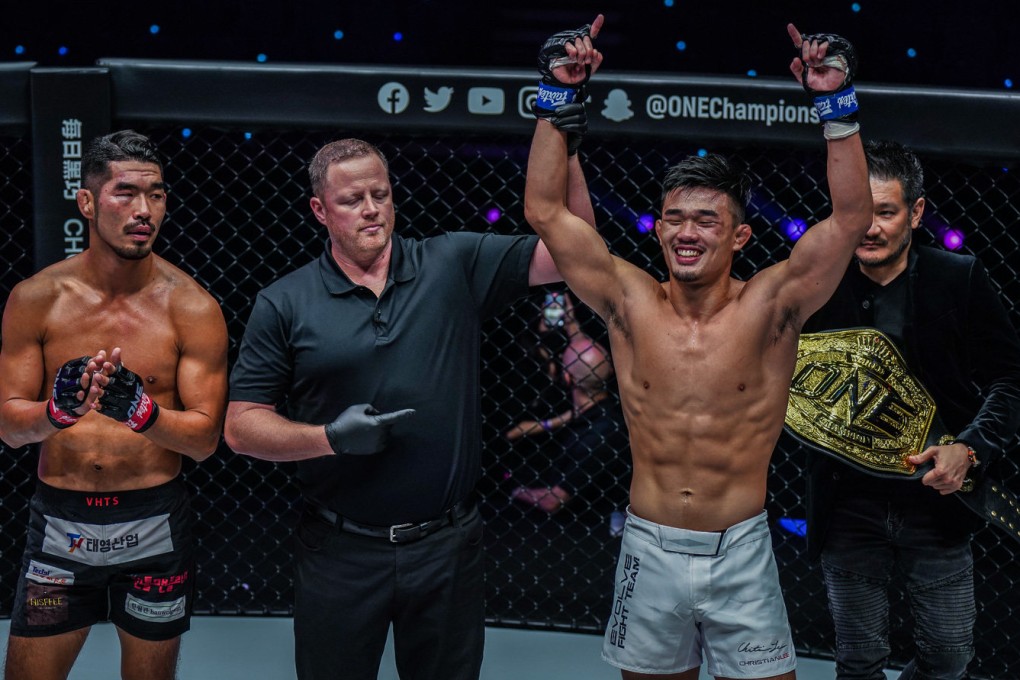 Christian Lee celebrates after regaining the ONE lightweight MMA title in Singapore. Photos: ONE Championship