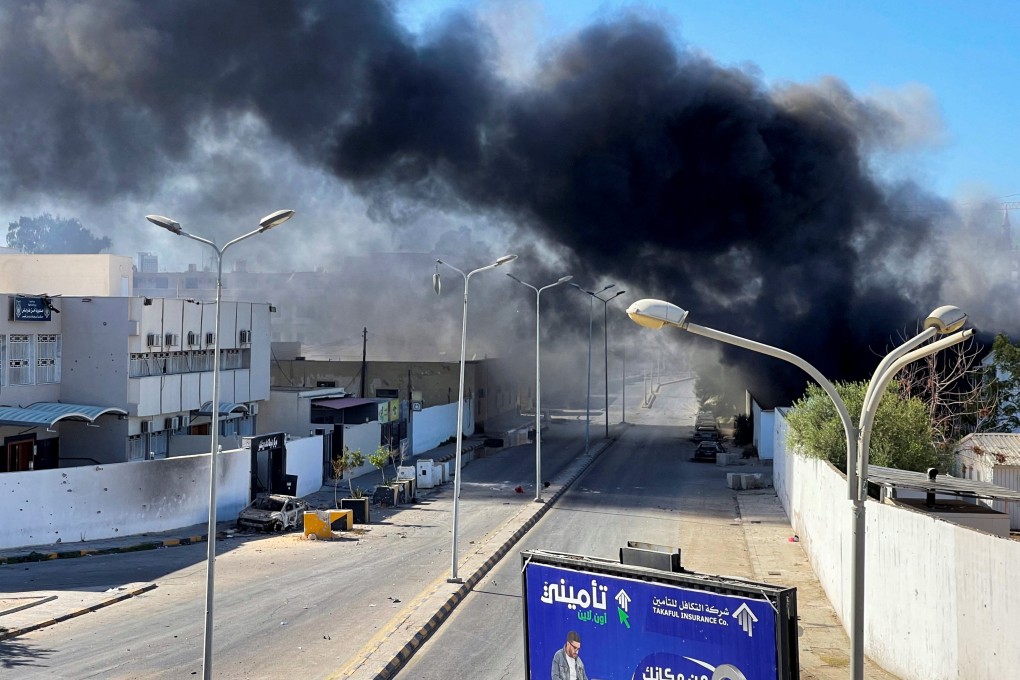 Smoke rises in the sky following clashes in Tripoli, Libya on Saturday. Photo: Reuters