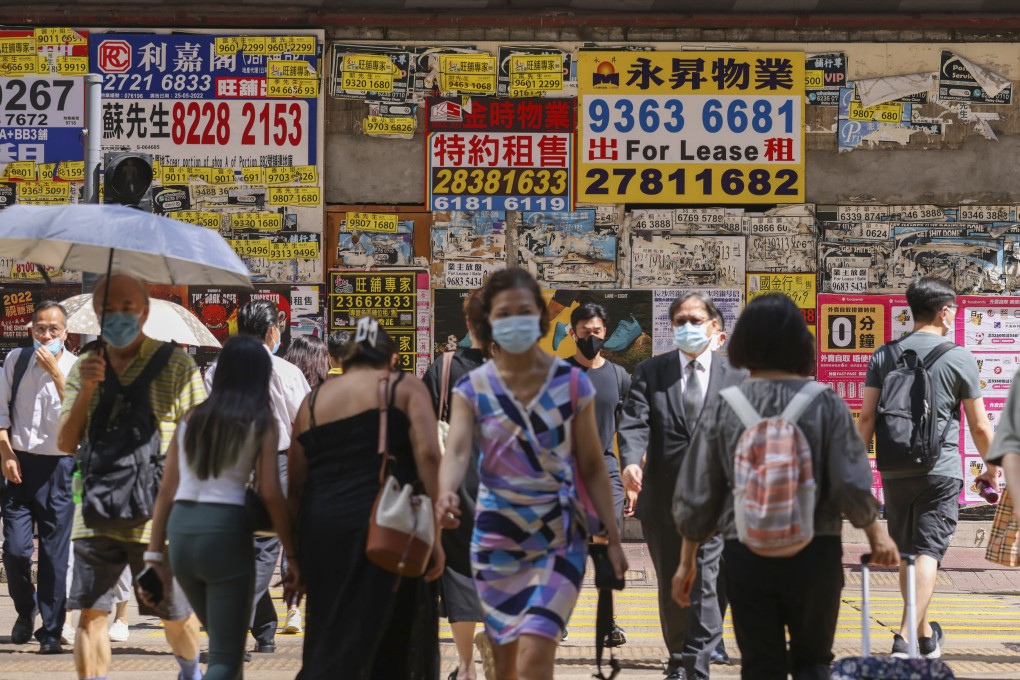 Pedestrians cross a road in front of closed shops in Causeway Bay, Hong Kong, on August 1. Photo: Nora Tam