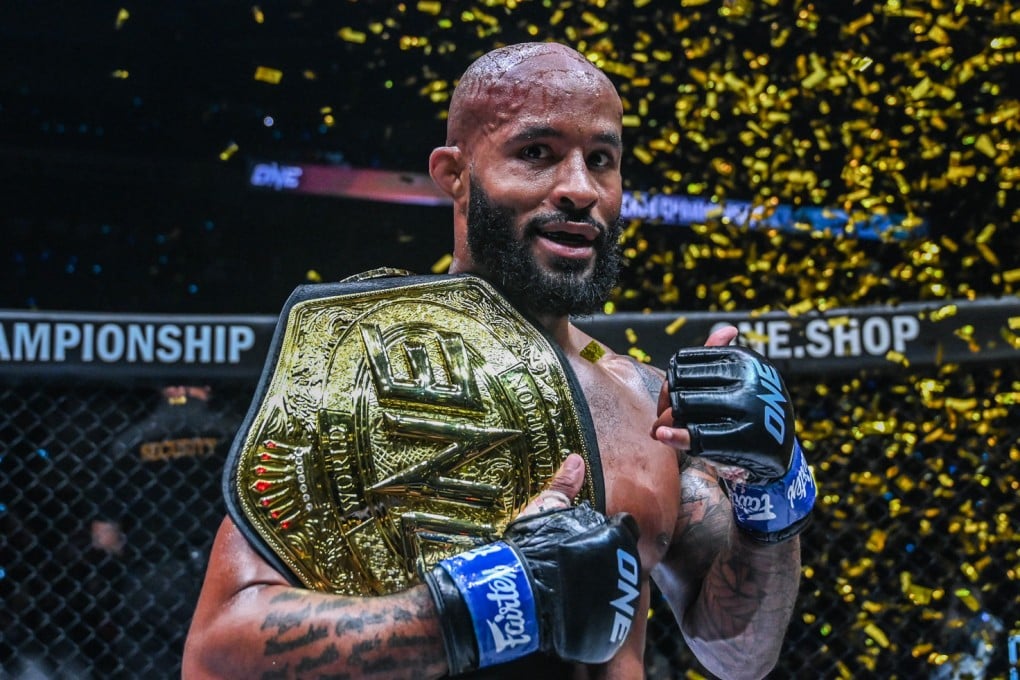 Demetrious Johnson poses with the ONE flyweight MMA title after knocking out Adriano Moraes. Photo: ONE Championship