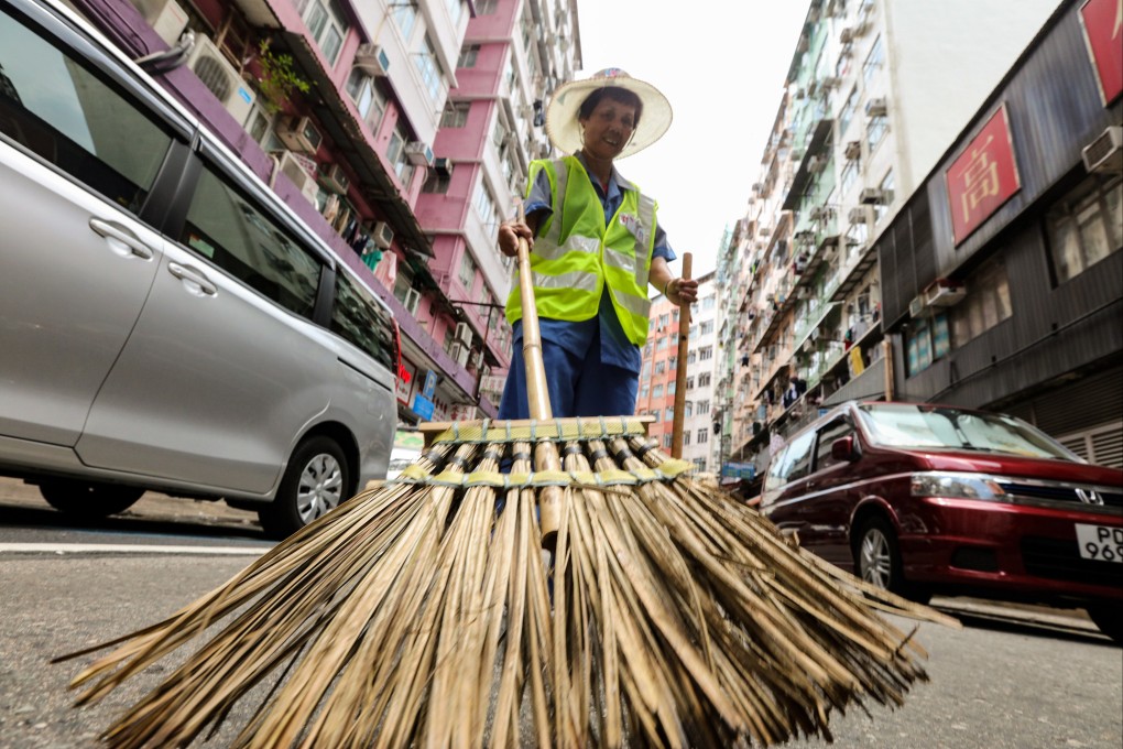 Cleaners have been suffering in Hong Kong’s hot weather. Photo: Felix Wong
