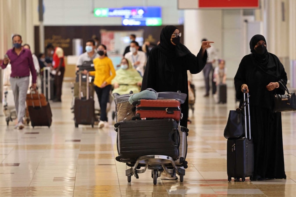 Travellers at Dubai Airport terminal 3. The Gulf emirate is gearing up to welcome many of the football fans attending the 2022 World Cup in nearby Qatar in November. Photo: AFP