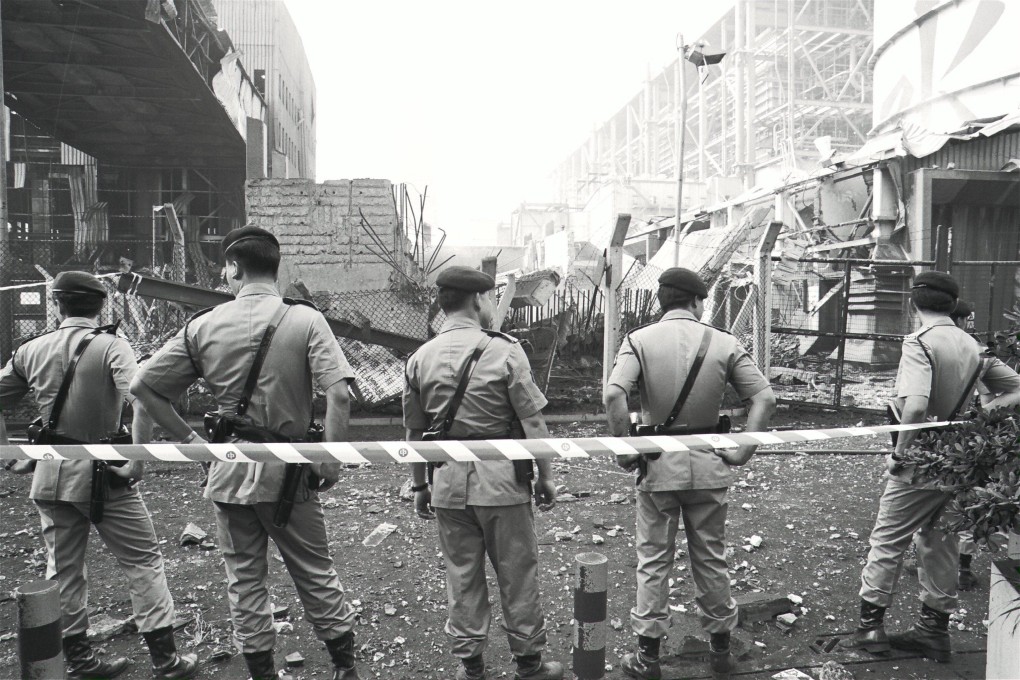 Police officers guard the scene of an explosion at China Light and Power’s Castle Peak plant in 1992 that killed two workers and triggered a fight for better compensation for fatalities at work. Photo: SCMP