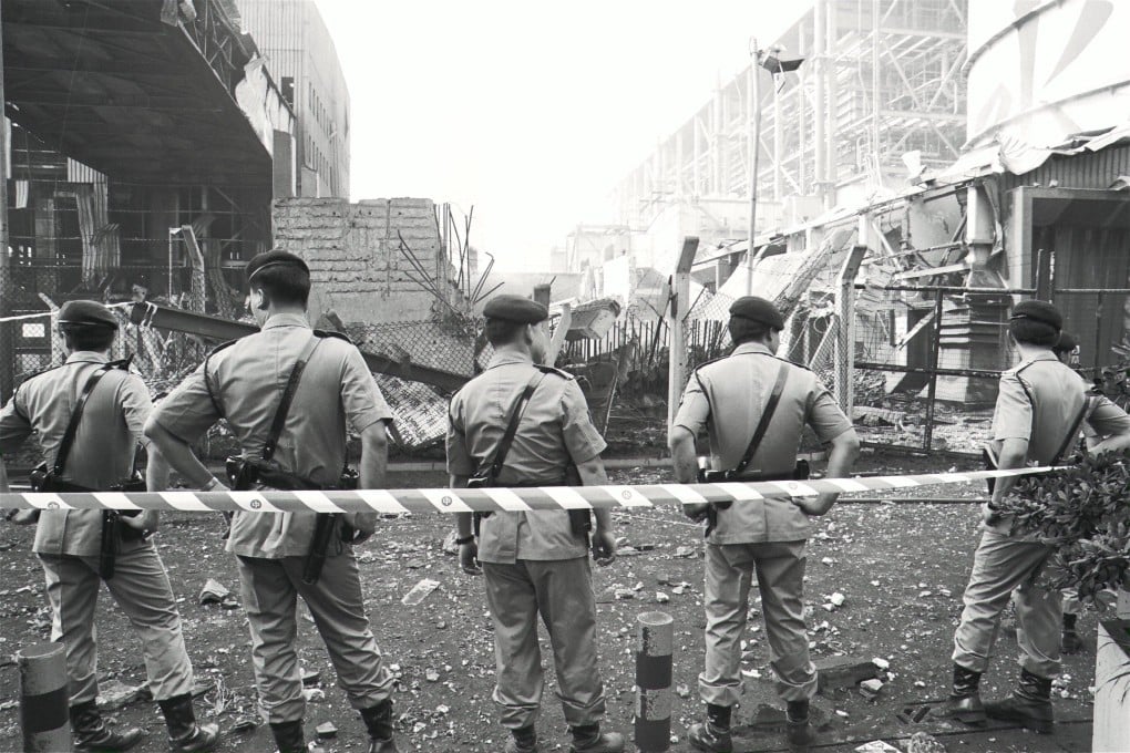 Police officers guard the scene of an explosion at China Light and Power’s Castle Peak plant in 1992 that killed two workers and triggered a fight for better compensation for fatalities at work. Photo: SCMP