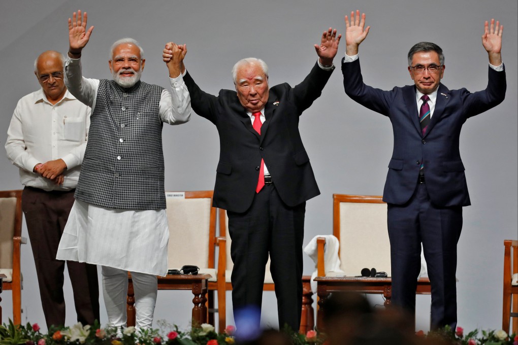 From left: Chief Minister of Gujarat Bhupendra Patel, India’s Prime Minister Narendra Modi, Japan’s Suzuki Motor Corp former chairman Osamu Suzuki and current chief Toshihiro Suzuki during an event to commemorate 40 years of Suzuki in India on Sunday. Photo: Reuters