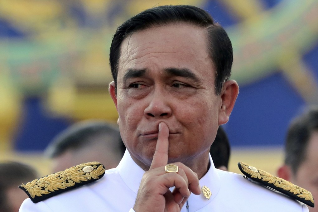 Prime Minister Prayuth Chan-ocha gestures after a group photo call with his cabinet members at Thailand’s Government House in 2019. Photo: AP