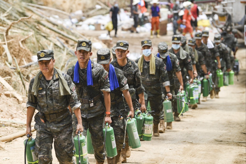 Firefighters head towards mountain fires in Chongqing on August 26, which saw weeks of record high temperatures before the rains arrived. Photo: Xinhua