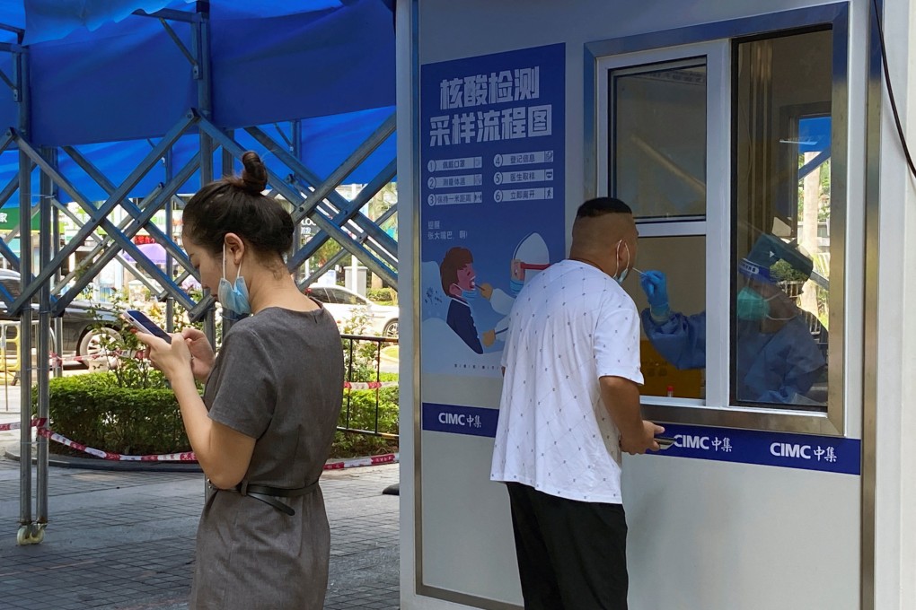 A man has a swab taken at a nucleic acid testing site in Shenzhen on Tuesday. Photo: Reuters