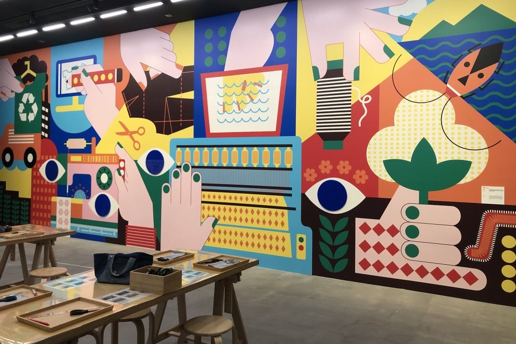 The “Garment Disassembly Line”, with a wall mural by Pop & Zebra, part of “We are Textile Culture Net!” at the Centre for Heritage, Arts and Textile in Tsuen Wan, Hong Kong. Photo: Enid Tsui