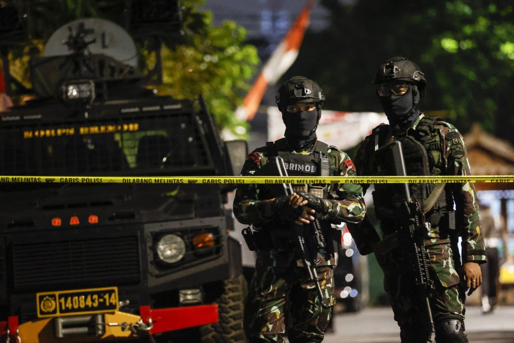 Indonesian armed police stand guard at a crime scene in Jakarta earlier this month. Photo: EPA-EFE