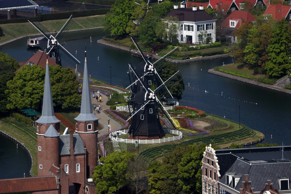 Windmills at the Huis Ten Bosch amusement park in Sasebo city of Japan’s Nagasaki Prefecture, on Friday, April 19, 2014. Photo: Bloomberg.