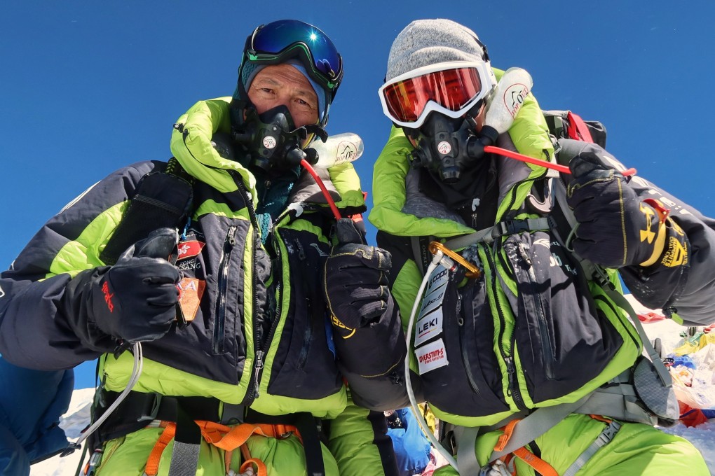 John Tsang (left) and his 18-year-old son Bob on the summit of Everest earlier this year. They talk about the physical and mental challenges they overcame to reach the summit. Photo: the Tsang family