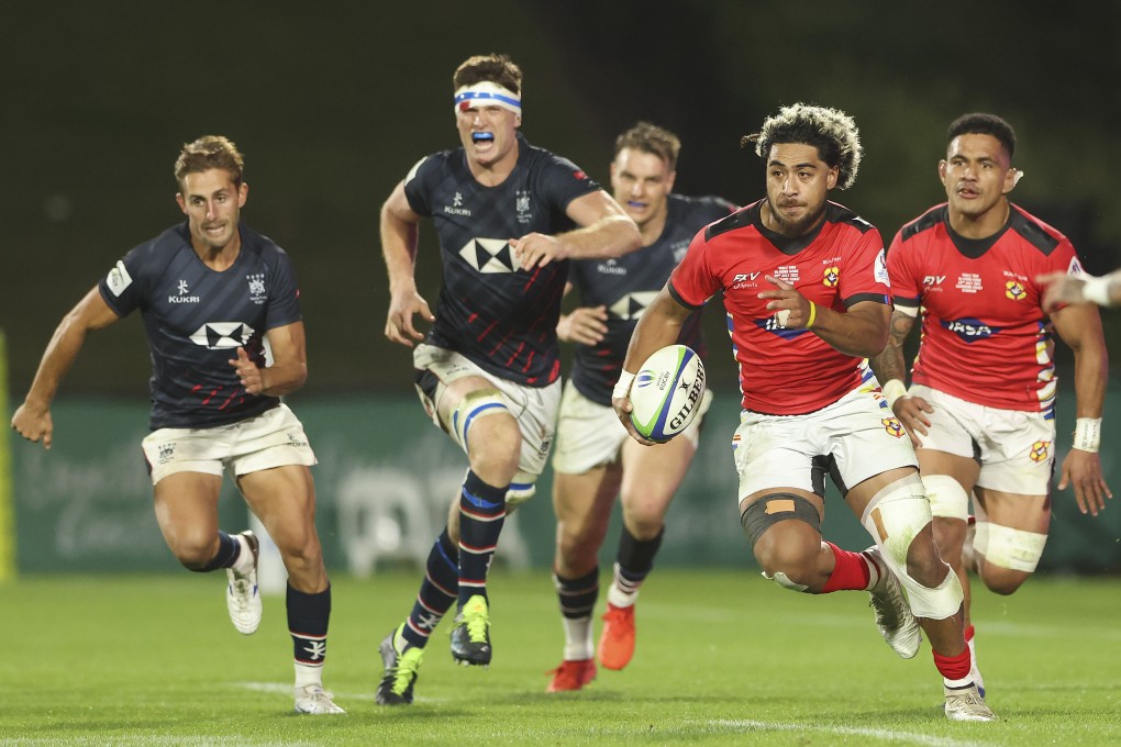 Tonga’s David Loloheai runs to score a try during the Rugby World Cup Pacific Play-Off match against Hong Kong. Photo: Getty Images