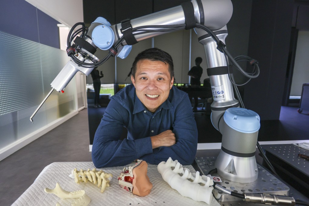 Cornerstone Robotics founder and Spirit of HK Awards 2022 nominee Samuel Au, with a drilling robot. Photo: Jonathan Wong