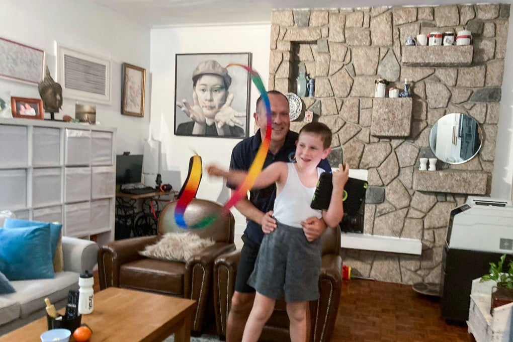 David Schaus and son Alex, nine, who is autistic and has attention deficit hyperactivity disorder, who were stranded at the airport for about 13 hours as they awaited confirmation that the youngster could quarantine at home on medical grounds. Photo: Handout.