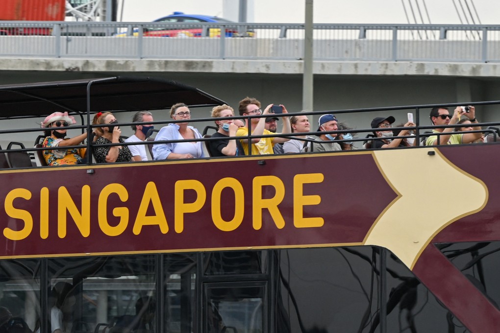 Tourists explore Singapore on an open top double-decker bus on August 16, 2022. Photo: AFP