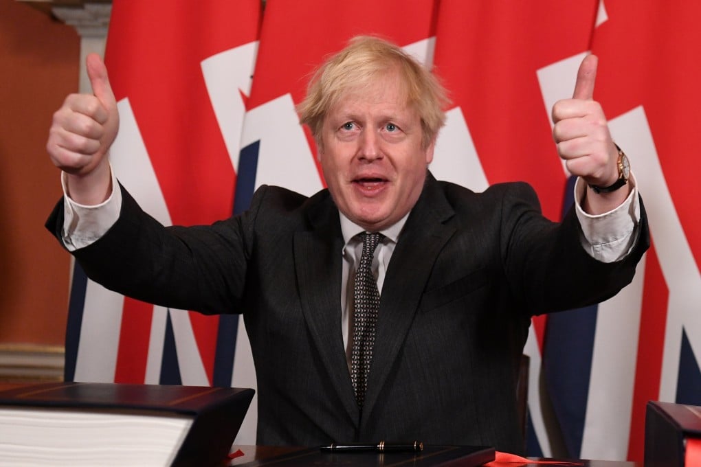 Britain’s Prime Minister Boris Johnson gives a thumbs up after signing the Brexit trade deal with the EU in London in December 2020. Photo: Reuters