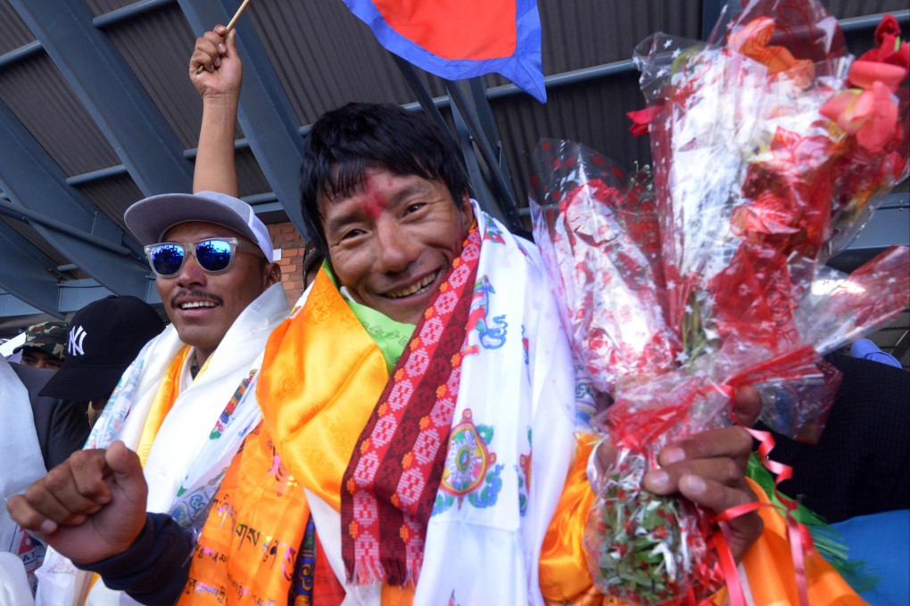 Mountaineer Sanu Sherpa arrives at Nepal’s Tribhuvan airport last month after becoming the first climber to summit all of the world’s 14 peaks above 8000 metres (26,247 ft) for the second time. Photo: AFP