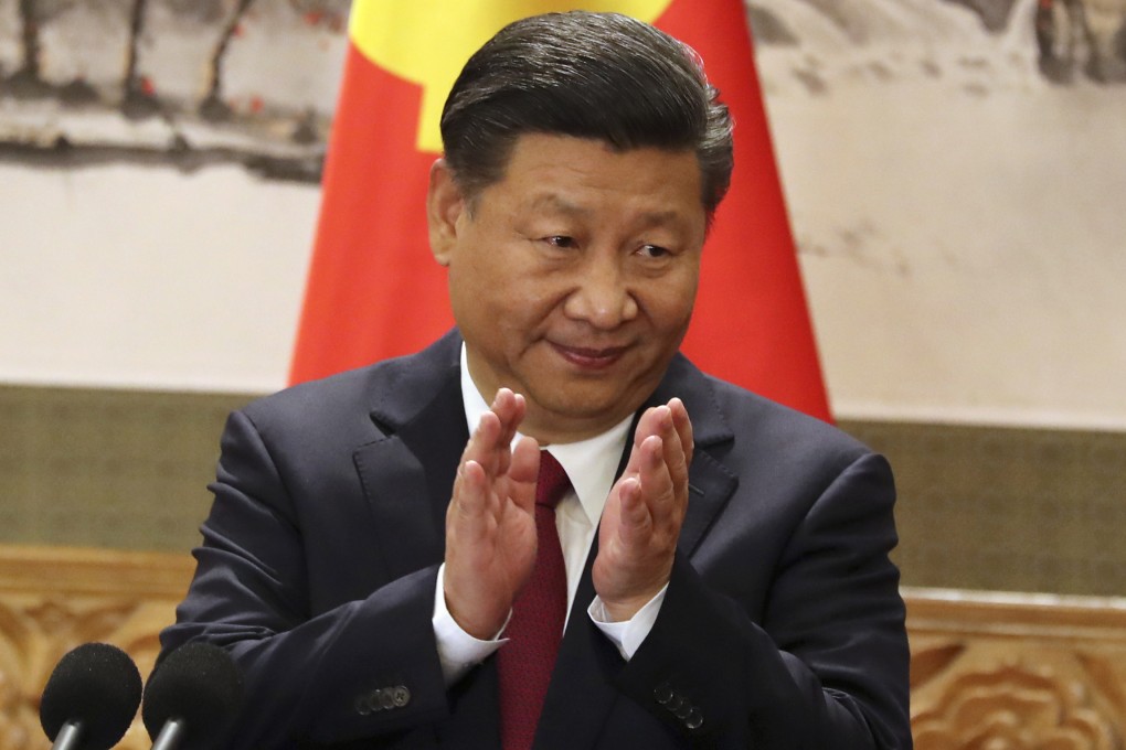 Chinese President Xi Jinping claps while addressing the media as he introduced new members of the Politburo Standing Committee on the final day of the 19th party congress at Beijing’s Great Hall of the People in 2017. Photo: AP