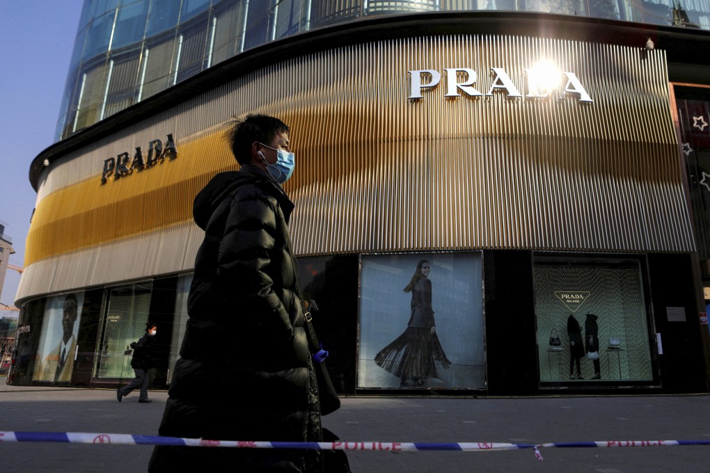 A Prada store in Beijing. Premium consumer and luxury goods brands have cut an 18 per cent year-on-year growth forecast on average for their mainland China businesses to 3 per cent, according to consultancy Oliver Wyman. Photo: Reuters