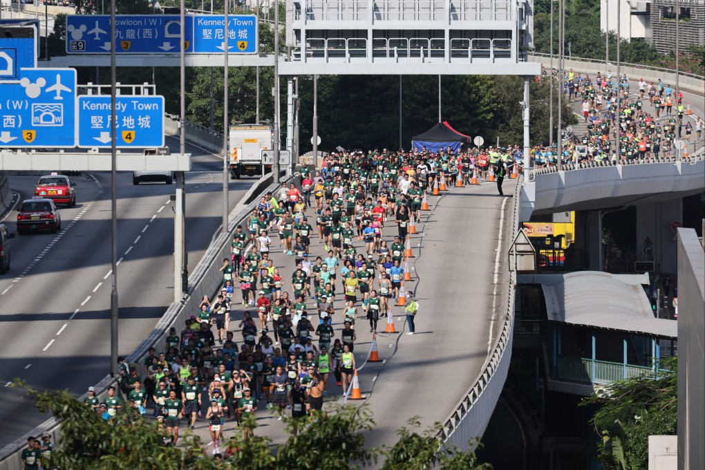 Marathon is always a popular event in Hong Kong as thousands of runners pass through Connaught Road West flyover during the 2021 Standard Chartered Hong Kong Marathon. Photo: May Tse