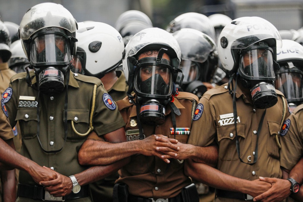 Sri Lankan police block demonstrators during an anti-government protest in Colombo. Photo: Reuters