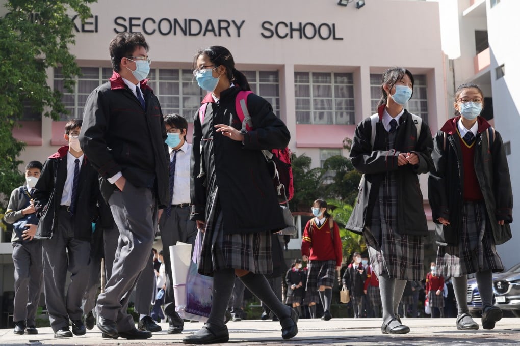 Students leave Christian and Missionary Alliance Sun Kei Secondary School in Tseung Kwan O on January 20. Secondary schools that want to hold full-day, in-person classes must ensure 90 per cent of students have three Covid-19 vaccinations by November 1. Photo: May Tse