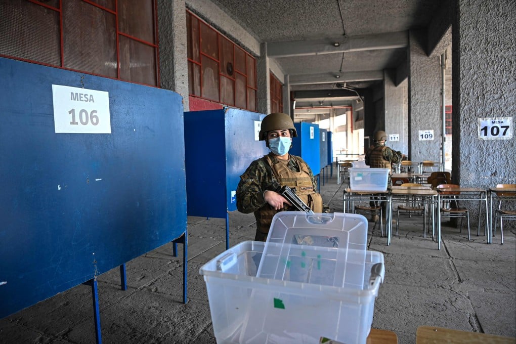 Soldiers provide security at a polling station being set up ahead of Sunday’s referendum on whether to adopt a new constitution, in Santiago. Photo: AFP