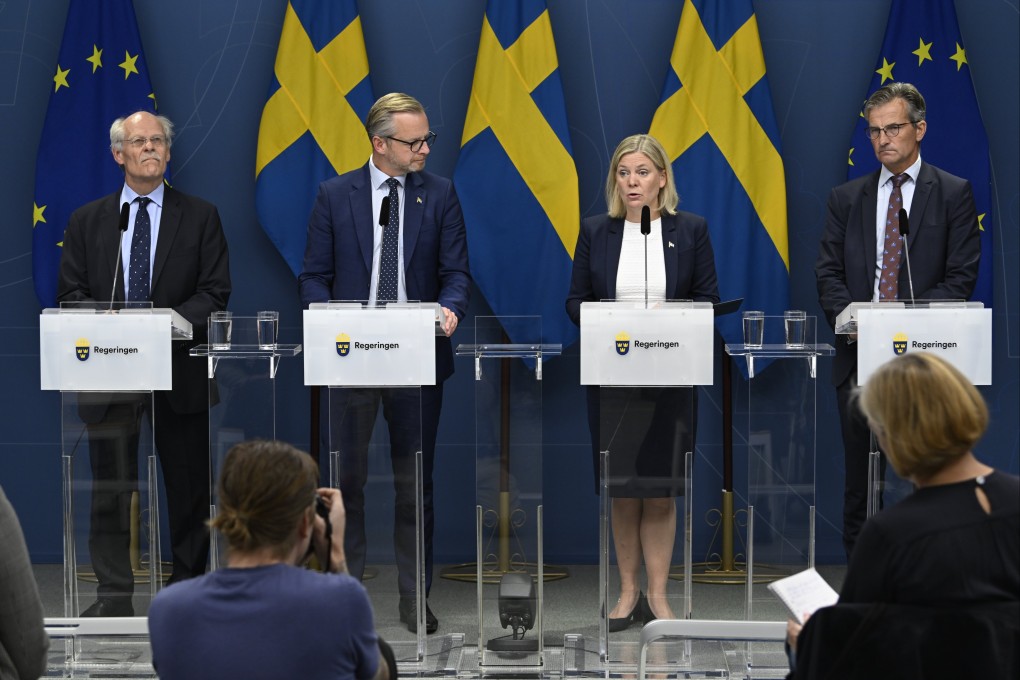 From left to right: Governor of Sveriges Riksbank, the central bank of Sweden, Stefan Ingves, Sweden’s Finance Minister Mikael Damberg, Prime Minister Magdalena Andersson and Director General of Finansinspektionen, Sweden’s financial supervisory authority, Erik Thedeen attend a news conference in Stockholm. Photo:  EPA-EFE