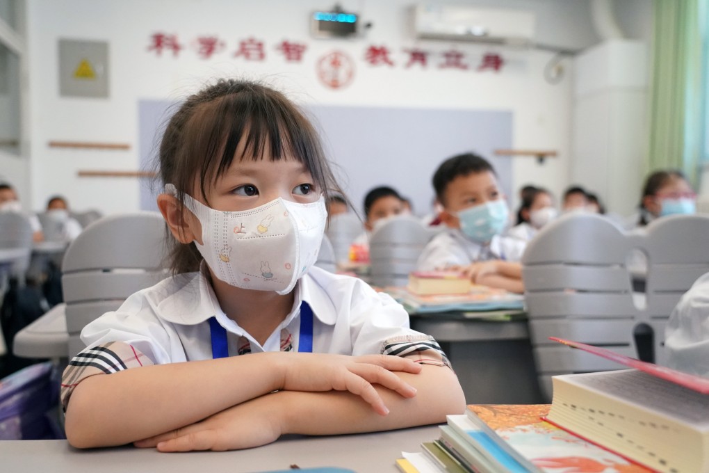 At Zhongguancun No 1 Primary School in Haidian district of Beijing, students attend class with masks. Photo: Xinhua