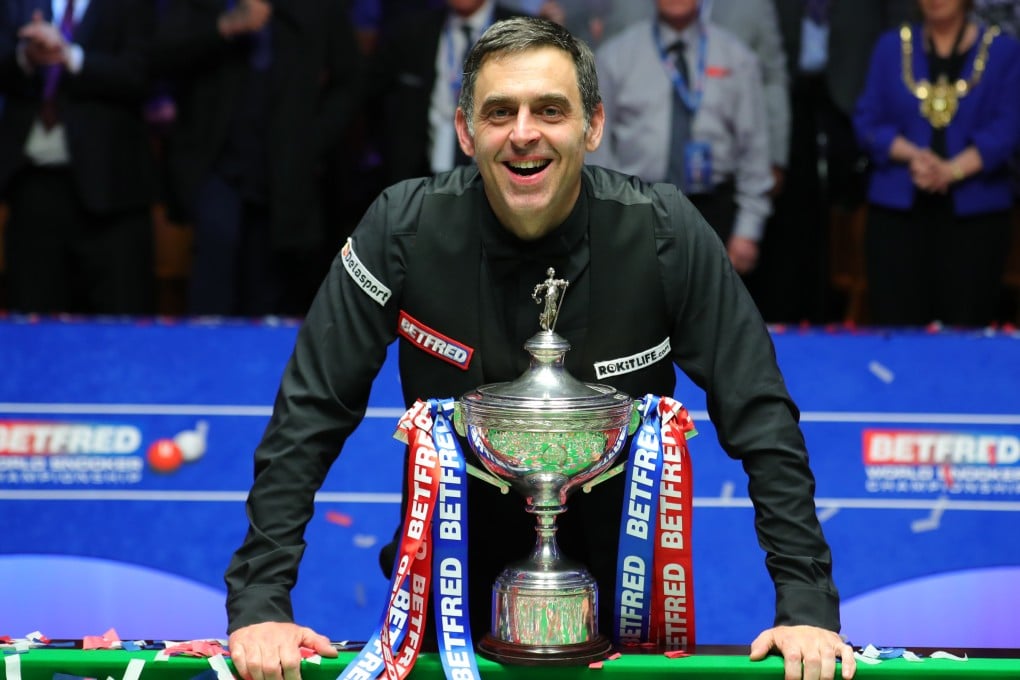 Ronnie O’Sullivan celebrates with the trophy after beating Judd Trump in the final of the 2022 World Snooker Championship in Sheffield, England. Photo: Xinhua