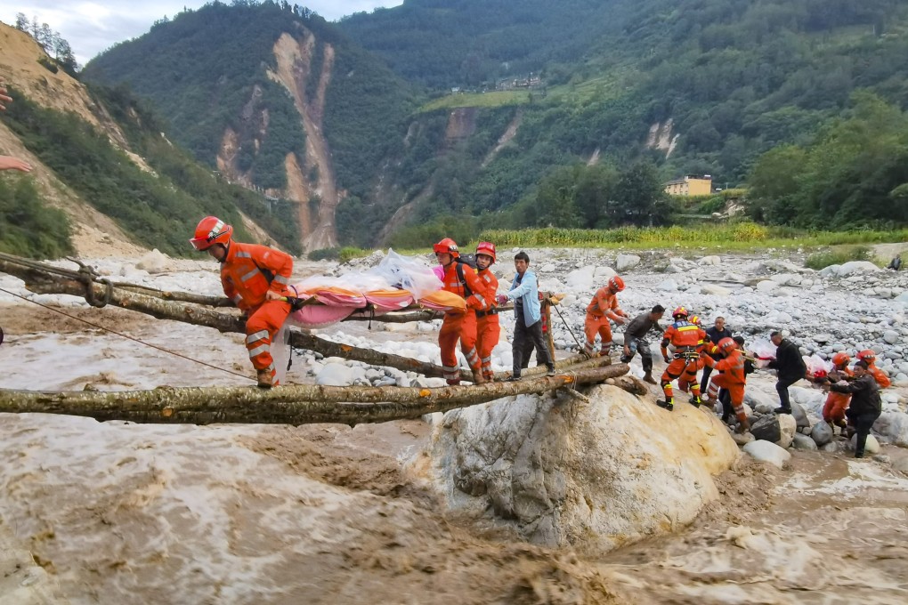 Survivors are taken to safety through treacherous terrain in Moxi town of Luding county, in the Chinese province of Sichuan. Photo: Xinhua