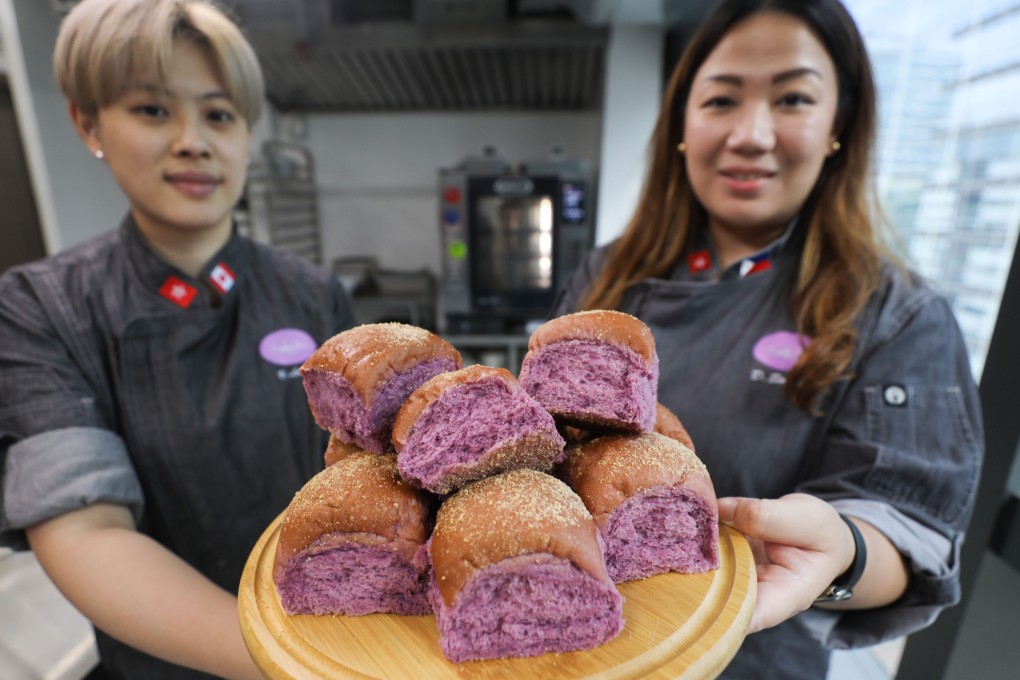 Veronica Leung (left) and Esther Claudine Lim Singzon, founder of bakery Purple Flour Hong Kong, with a plate of ube pandesal. Photo: Xiaomei Chen