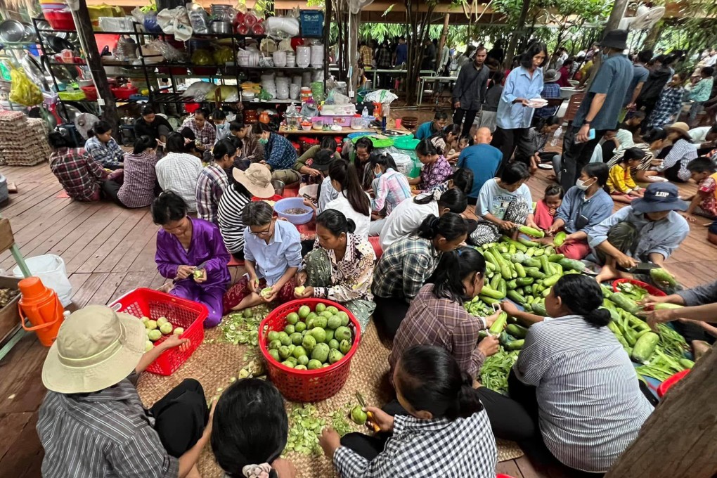The cult group’s believers peel vegetables at the farmhouse. Photo: Facebook