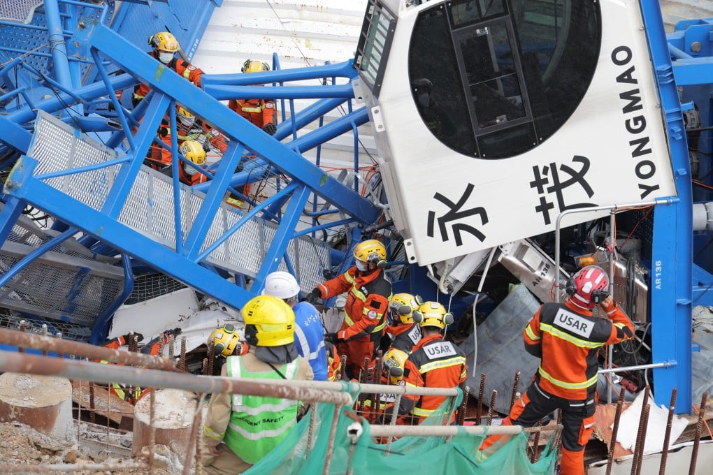 The tower crane collapsed on Wednesday morning, trapping workers and crushing containers on the building site. Photo: Jelly Tse