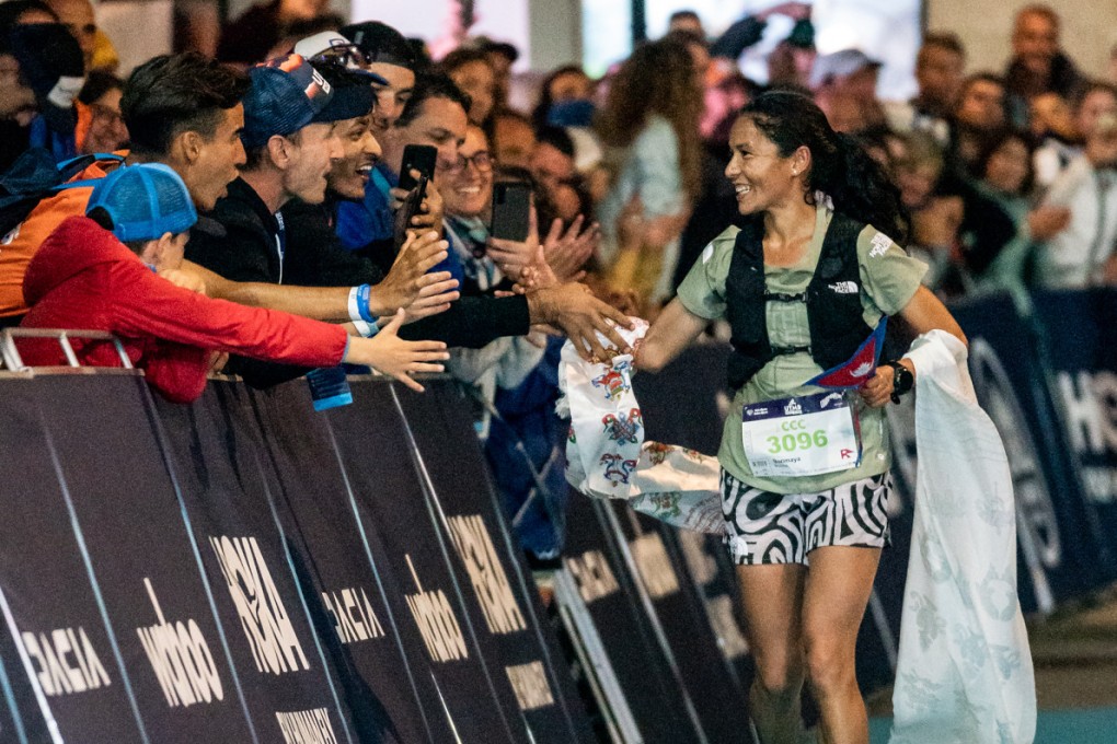 Fans celebrate with Sunmaya Budha as she crosses the finish line in second at the UTMB CCC. Photos: Olly Bowman/Asia Pacific Adventure