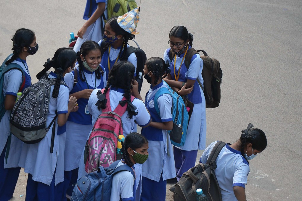 Pupils gather outside a school in Hyderabad in India’s  Telangana state on February 1, 2021. Photo: AFP