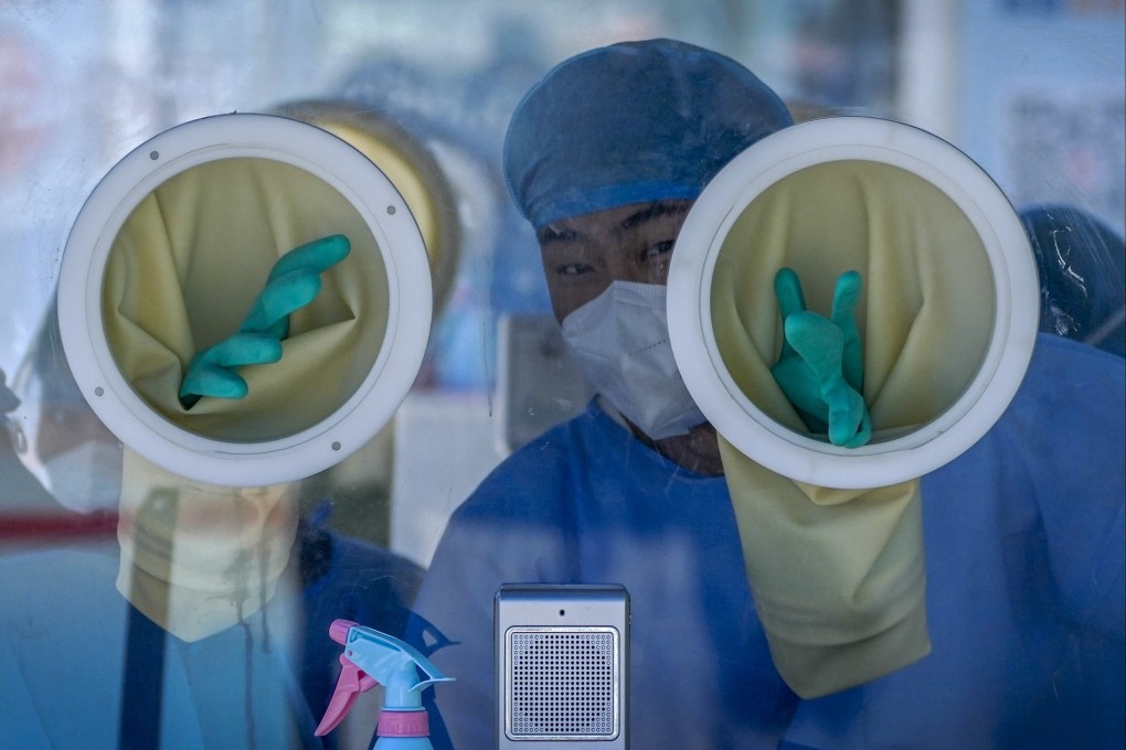 A medical worker in protective gear in Beijing, China. A UN report points to the Covid-19 pandemic as a major driver of the global reversion. Photo: AP