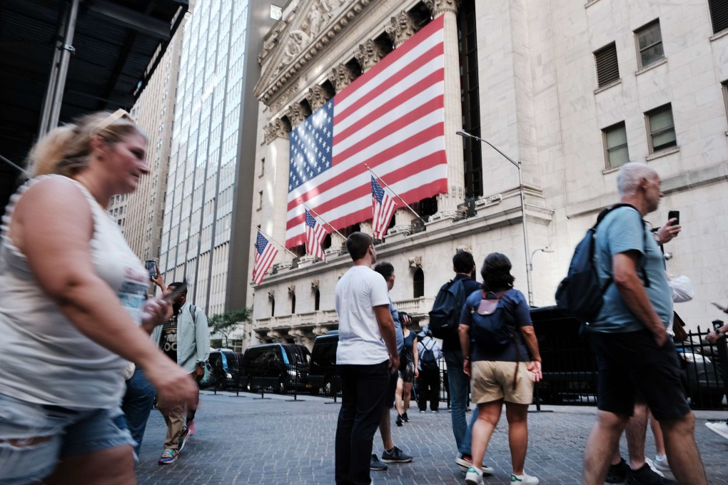 People walk past the New York Stock Exchange on September 1. US core inflation remains high, at close to 6 per cent. Photo: AFP