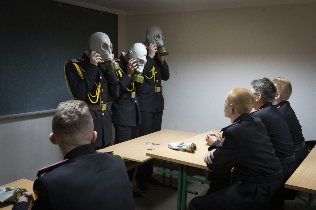 Cadets practice an emergency situation during a lesson in a bomb shelter at a cadet lyceum in Kyiv, Ukraine. Photo: AP