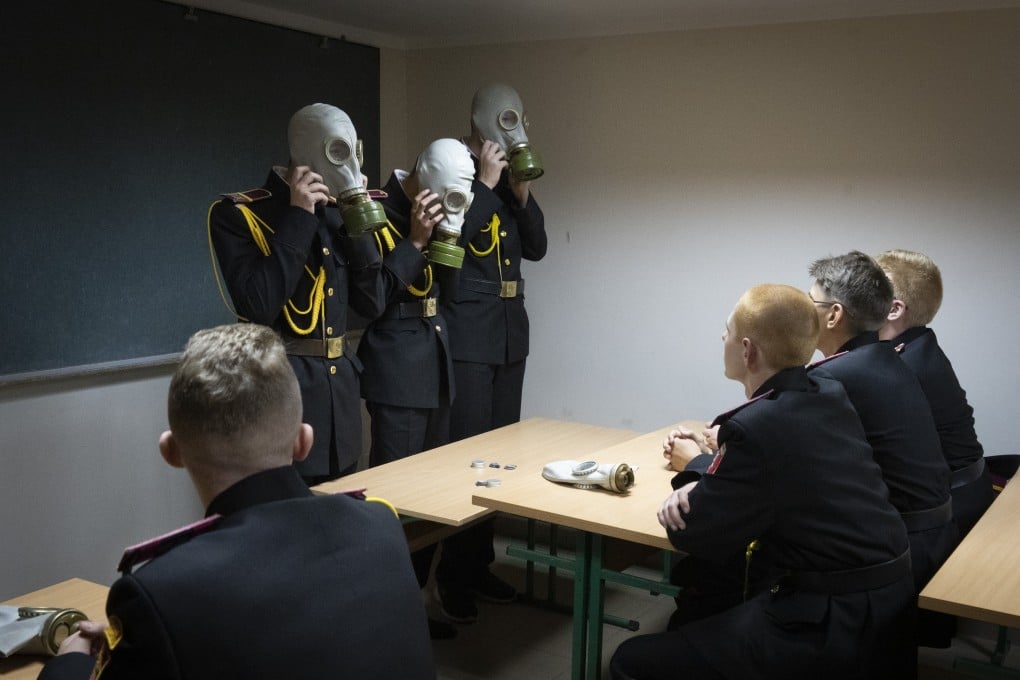 Cadets practice an emergency situation during a lesson in a bomb shelter at a cadet lyceum in Kyiv, Ukraine. Photo: AP