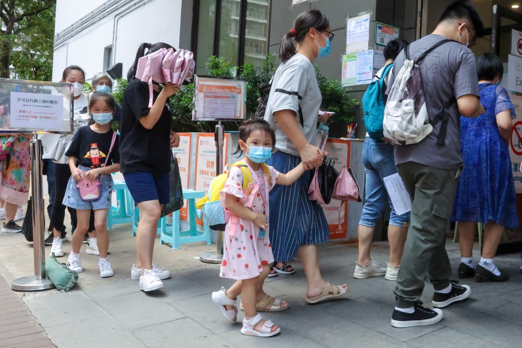 Parents bring their young children for jabs at the Kwun Chung Municipal Services Building. Photo: Edmond So