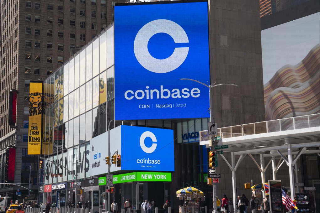 Monitors display Coinbase signage during the company’s initial public offering at the Nasdaq market site on April 14, 2021 in New York City. Photo: Getty Images