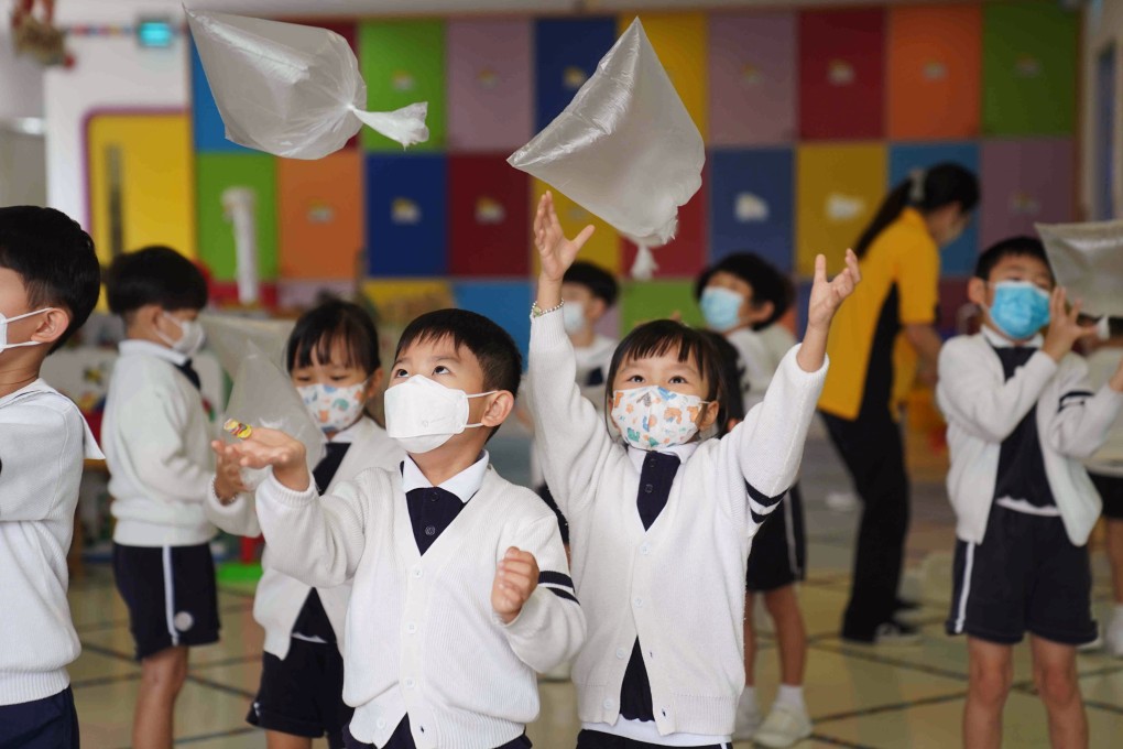 Children take part in an activity as classes resume at a kindergarten in Tai Po on May 3. Some have expressed concern about the effects the mask mandate is having on children’s health and educational development. Photo: Sam Tsang