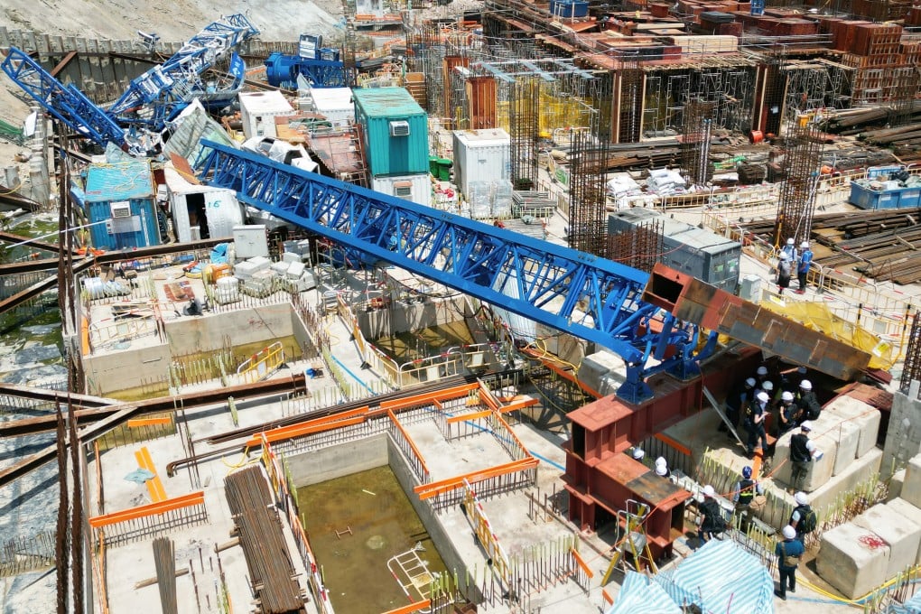 Police officers inspect a collapsed crane at a Housing Society construction site on Anderson Road in Sau Mau Ping on September 8. The accident killed three people and injured six more. Photo: Felix Wong