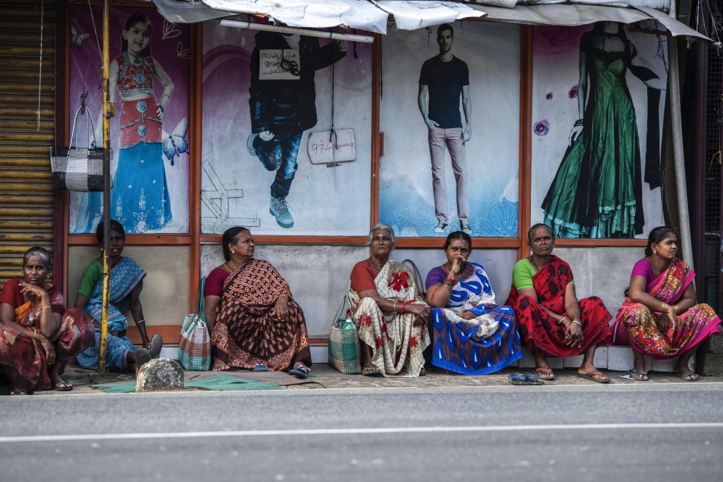 Women sit by a roadside in the morning in anticipation of daily-wage jobs in Kochi, in the southern Indian state of Kerala, on August 10. Even as the pandemic gradually abates, allowing room for a return to some form of business as usual, the pace of recovery has been slower for women. Photo: AP